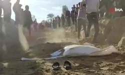 Filistinliler, İsrail'in Gazze Şeridi'ne düzenlediği saldırılarda kaybettikleri yakınlarını toplu mezarlara defnediyor