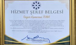 Kamuran Tuna’ya Hizmet Şeref Belgesi verildi