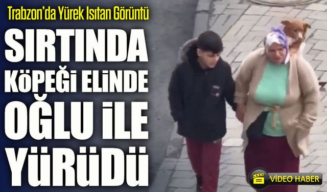 Trabzon’da Yürek Isıtan Görüntü; Sırtında Köpeği Elinde Oğlu İle Yürüdü