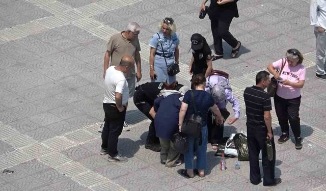 Sıcaktan bayılan kadının yardımına vatandaşlar ve polisler koştu